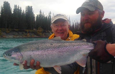 Nick Smith with Billy coulliette releasing 10 pound Alaska Rainbow Trout Kenai River September 2014