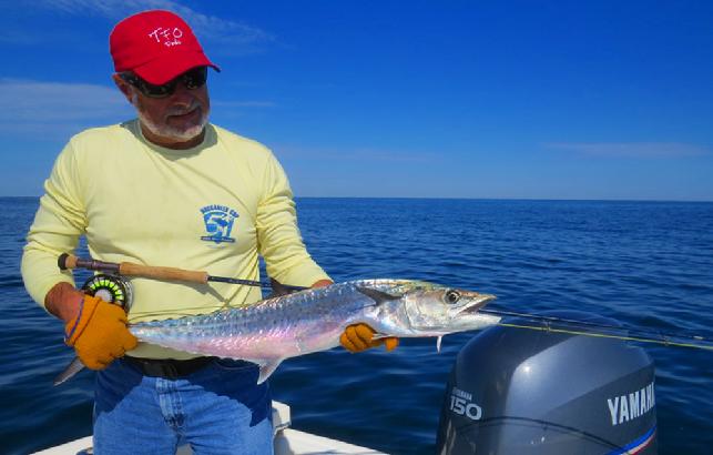 Gary Caputi releasing King on Fly, October 2014 aboard Fly Reel